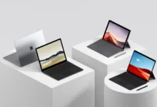 a group of laptops on white cubes