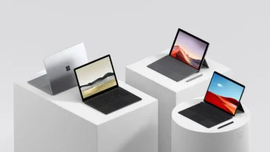 a group of laptops on white cubes